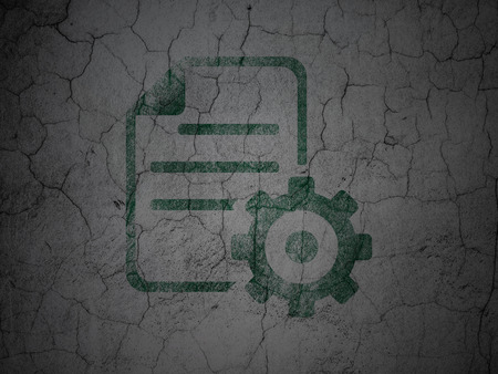 Programming concept: Green Gear on grunge textured concrete wall backgroundの写真素材