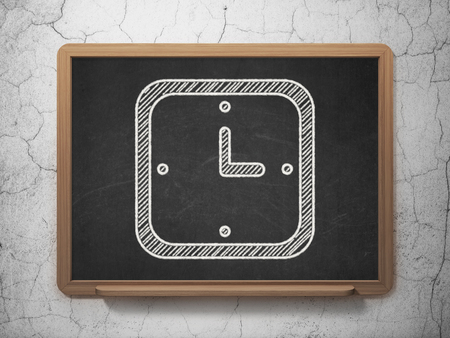 Time concept: Watch icon on Black chalkboard on grunge wall backgroundの写真素材