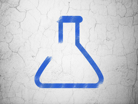 Science concept: Blue Flask on textured concrete wall backgroundの写真素材