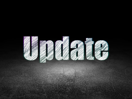 Web development concept: Glowing text Update in grunge dark room with Dirty Floor, black backgroundの写真素材