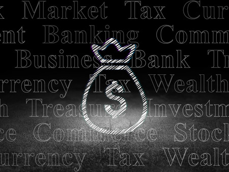 Banking concept: Glowing Money Bag icon in grunge dark room with Dirty Floor, black background with  Tag Cloudの写真素材