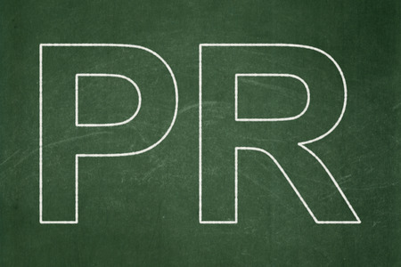 Advertising concept: text PR on Green chalkboard backgroundの写真素材