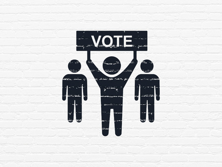 Political concept: Painted black Election Campaign icon on White Brick wall backgroundの写真素材