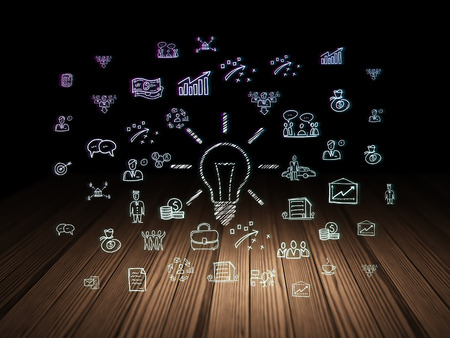 Finance concept: Glowing Light Bulb icon in grunge dark room with Wooden Floor, black background with  Hand Drawn Business Iconsの写真素材