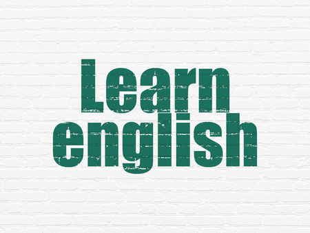 Studying concept: Painted green text Learn English on White Brick wall backgroundの写真素材