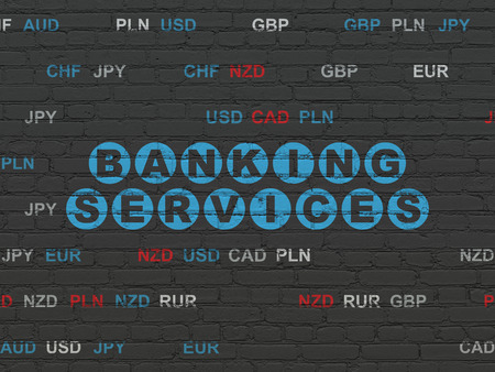 Money concept: Painted blue text Banking Services on Black Brick wall background with Currencyの写真素材