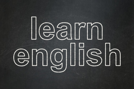 Education concept: text Learn English on Black chalkboard backgroundの写真素材