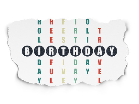 Holiday concept: Painted black word Birthday in solving Crossword Puzzle on Torn Paper backgroundの写真素材