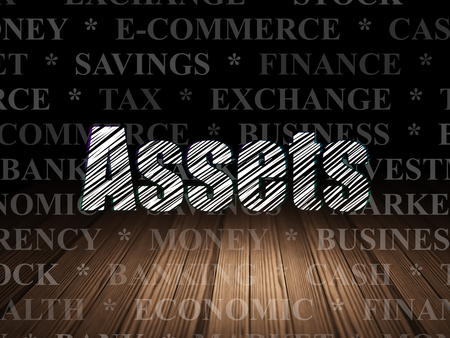 Money concept: Glowing text Assets in grunge dark room with Wooden Floor, black background with  Tag Cloudの写真素材