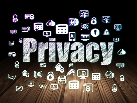 Security concept: Glowing text Privacy,  Hand Drawn Security Icons in grunge dark room with Wooden Floor, black backgroundの写真素材