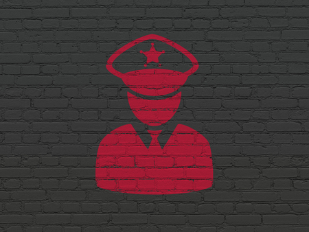 Security concept: Painted red Police icon on Black Brick wall backgroundの写真素材