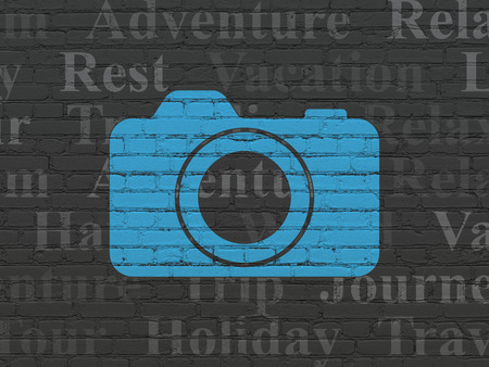 Tourism concept: Painted blue Photo Camera icon on Black Brick wall background with  Tag Cloudの写真素材