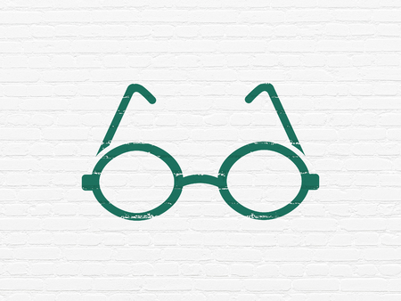 Science concept: Painted green Glasses icon on White Brick wall backgroundの写真素材