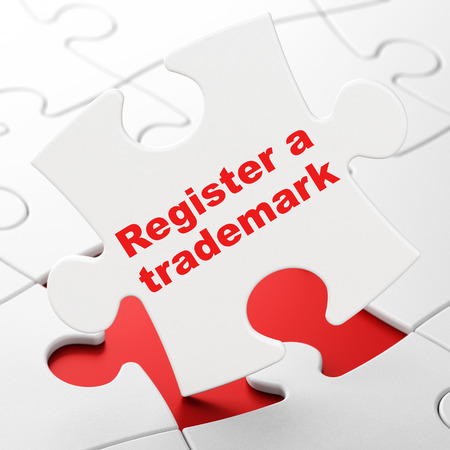 Law concept: Register A Trademark on White puzzle pieces background, 3D renderingの写真素材
