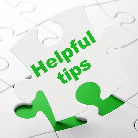 Education concept: Helpful Tips on White puzzle pieces background, 3D renderingの写真素材