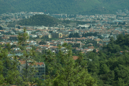 Mountain town panoramic view. landscape with a city between the hillsの写真素材