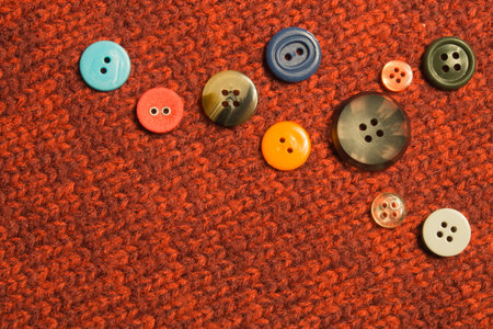 Various sewing buttons on textile background. copy spaceの写真素材