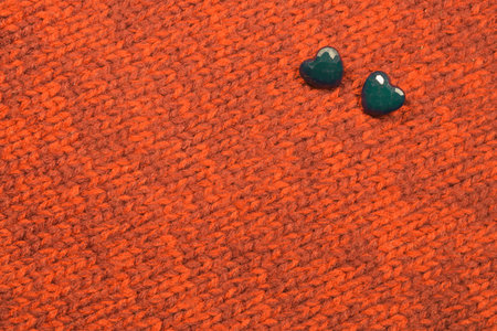 Various sewing buttons on textile background. copy space