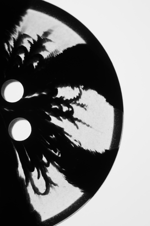 Transparent button with pattern. macro view. black silhouetteの写真素材