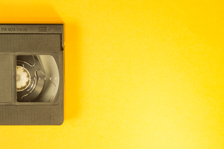 Video cassette isolated on yellow background. vhs with copy spaceの写真素材