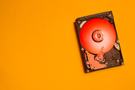 Colorful hdd. open hard disk drive. The concept of data storage. data array. hard drive from the computer. hdd with mirror effect. copy spaceの写真素材