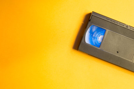 Video cassette isolated on yellow background. vhs with copy space