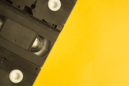 Video cassette isolated on yellow background. vhs with copy spaceの写真素材