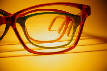 Rimmed eyeglasses closeup on a white background abstract viewの写真素材