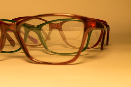 Rimmed eyeglasses closeup on a white background abstract viewの写真素材