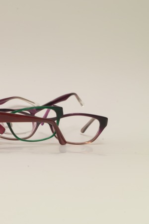 Rimmed eyeglasses closeup on a white background abstract viewの写真素材