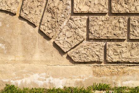 Old brick wall background with copy space. wall from squared bricks. cracked stone wall textureの写真素材