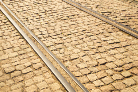Brick texture. tram rails on stone pavement backgroundの写真素材