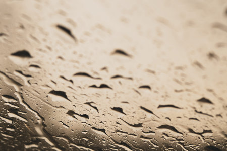 Raindrops on the window close up. rain drops on the glass macro. water drops falling down on window....