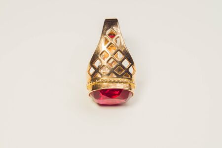 Golden ring with ruby isolated on white backgroundの写真素材