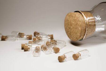 Little bottles with cork stopper isolated on white. big bottle with cork. glass vessels. transparent containers. test tubesの写真素材