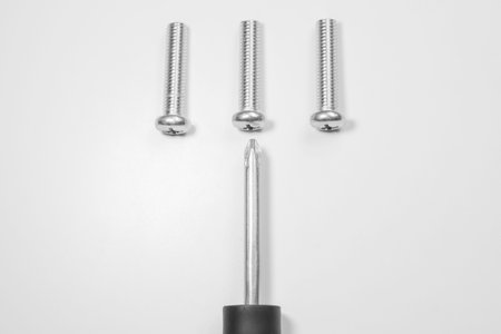 Steel screw on a white background. working tools