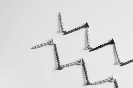 Steel screw on a white background. working toolsの写真素材
