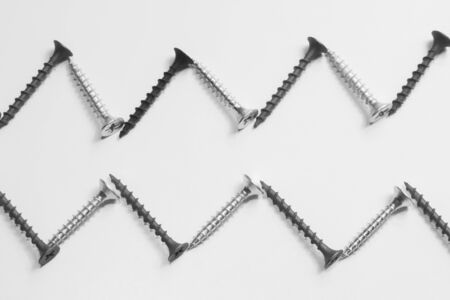 Steel screw on a white background. working toolsの写真素材