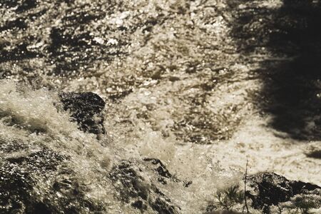 Waterfall nature background. rushing stream water. rocky flowing riverの写真素材