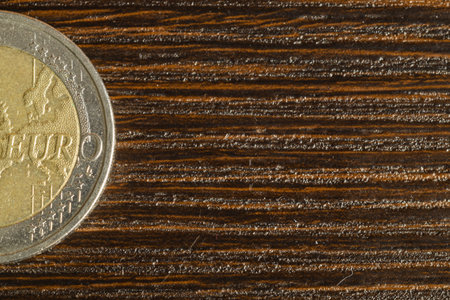 Euro coin on a dark wooden background. european moneyの写真素材