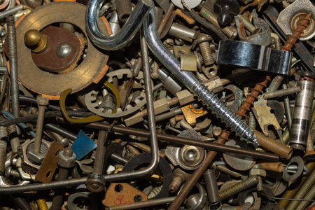 Old screws background. heap of tapping screws. work tool. pile of fasteners. bolts and nuts. metal...