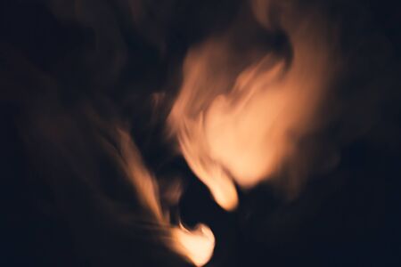 Colored smoke on black backdrop. brown fog abstract backgroundの写真素材
