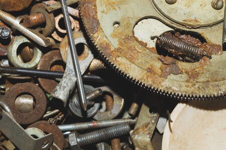 Pile of fasteners and screws close up. scrap metal. different metal partsの写真素材