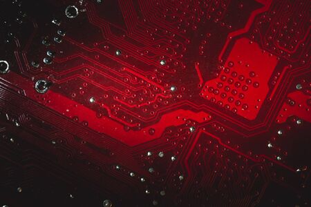 Dusty motherboard close up. circuit board with dust and defects. modern technologies. micro elements of computer with connections and traces. Intelligent technology abstract backgroundの写真素材