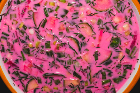Cold beet soup close up. vegetable soup with beetroot and greens