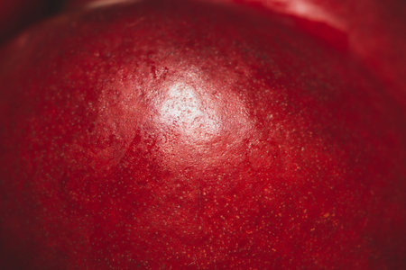 Cherry surface macro. texture of red fruit close up