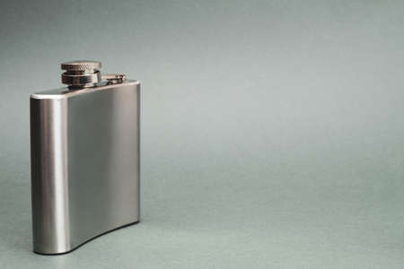 Stainless steel flask. personal accessory for alcohol drinks. copy spaceの写真素材