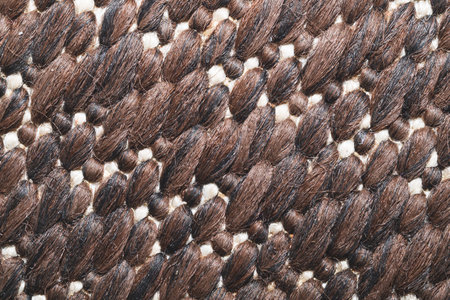Fabric texture extremely close up. wicker surface of the rug. woven background. stitches of thread