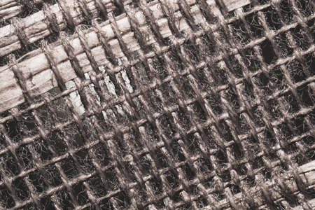 Braided fibers close up. woven texture. wicker background. knitted surface. weaving pattern. stitches of threadの写真素材