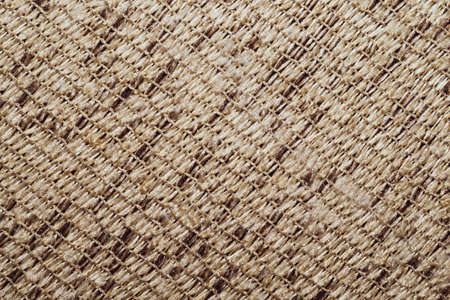 Braided fabric close up. woven texture. knitted material surface. stitches of threadの写真素材